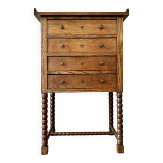 4-drawer chest of drawers in dark wood