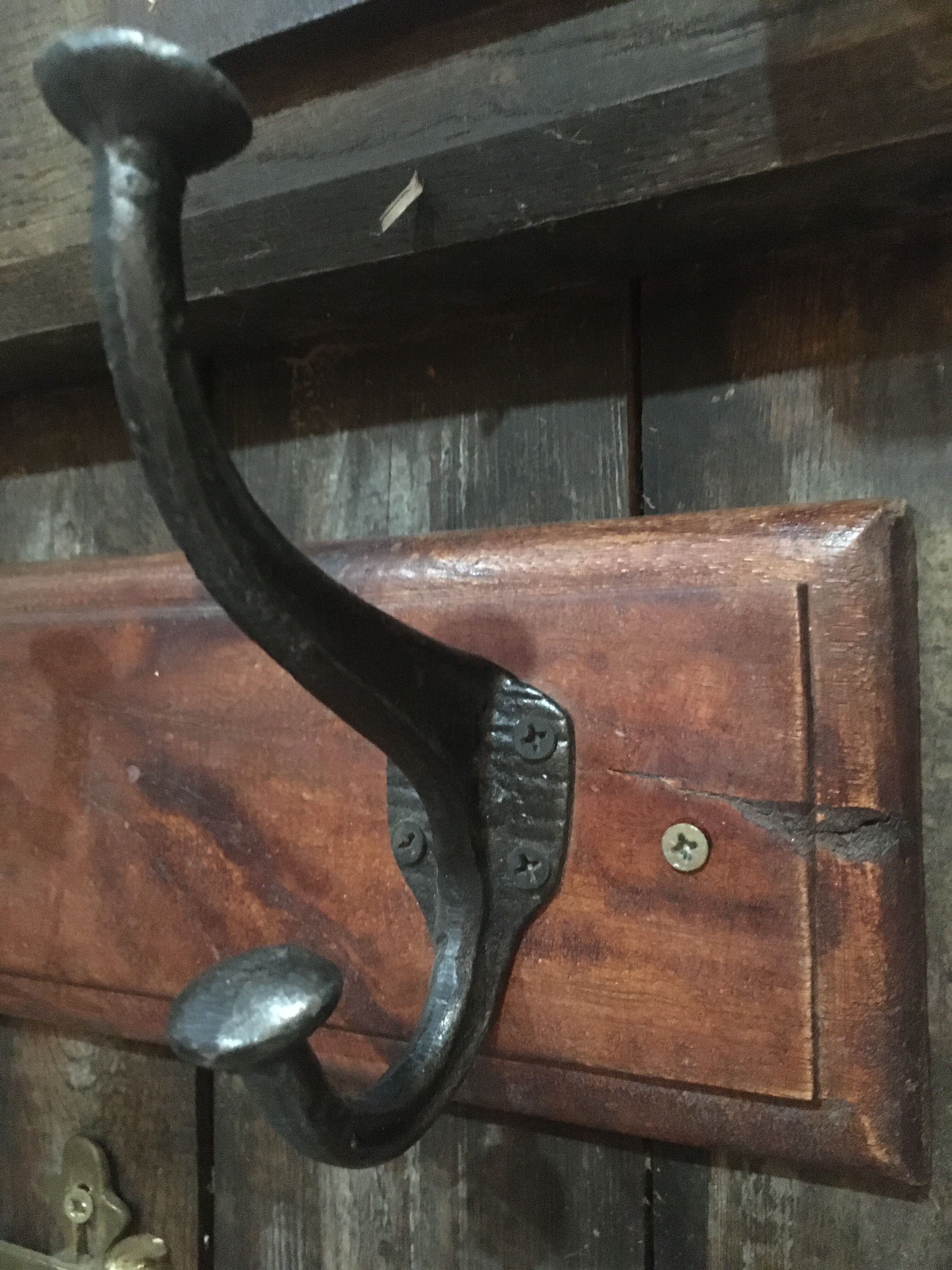 Metal patère on wood