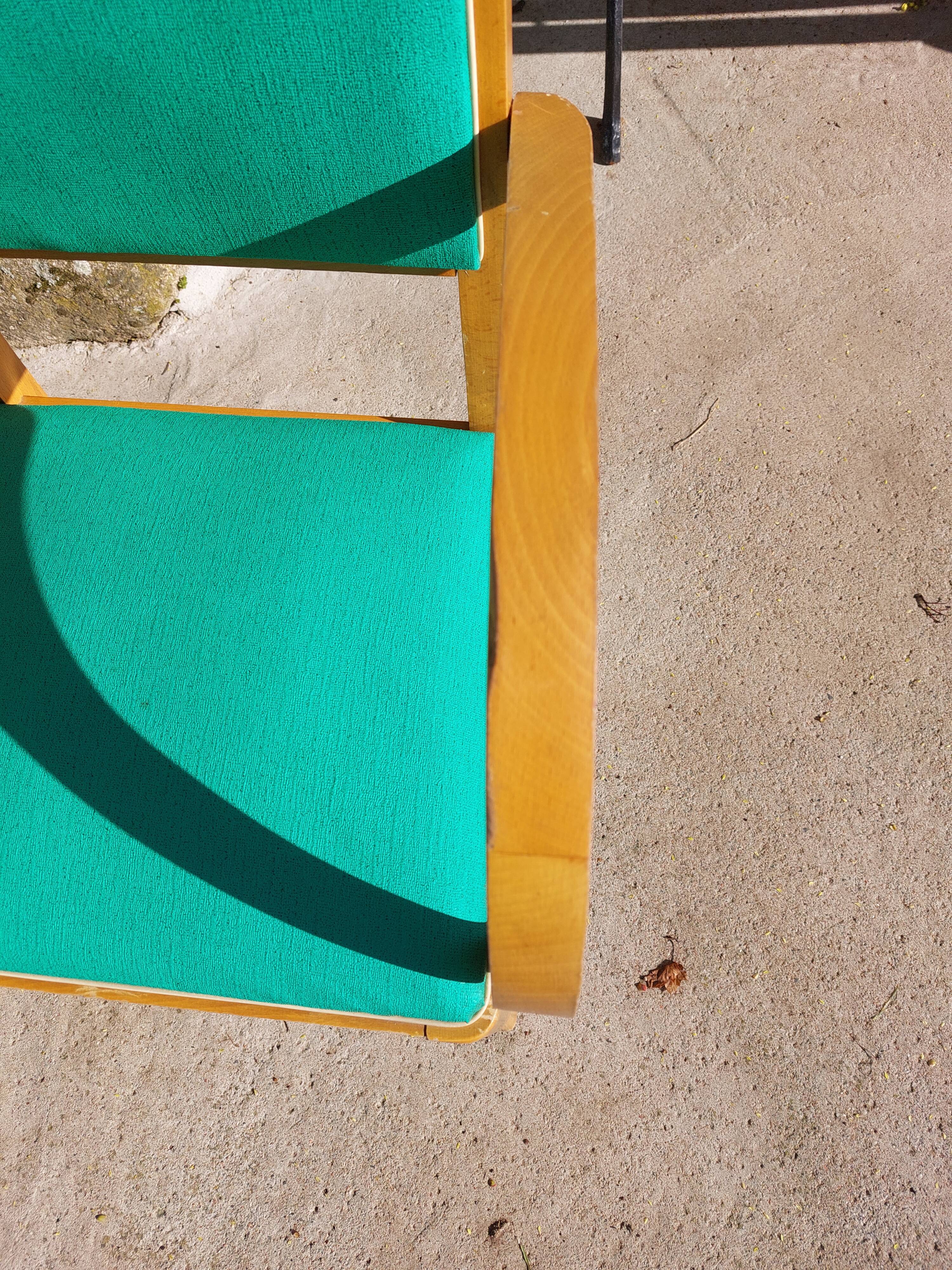 3 vintage bridge chairs with rounded armrests.