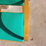 3 vintage bridge chairs with rounded armrests.