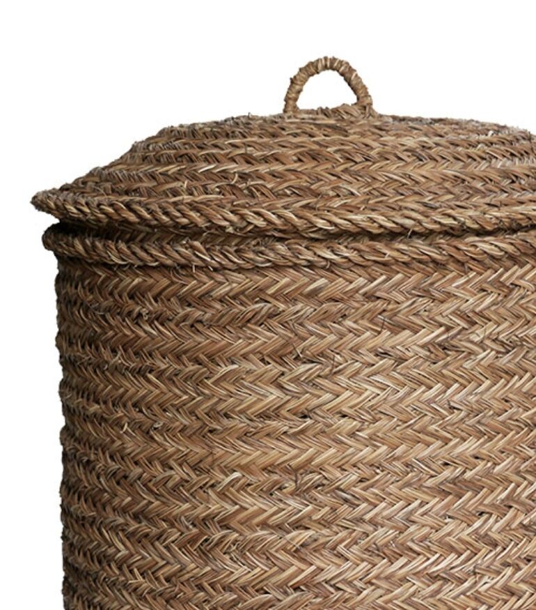 Hand-woven laundry basket in natural rush