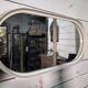 Oval mirror in white lacquer from the 1970s.
