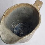 Handcrafted glazed stoneware pitcher decorated by hand