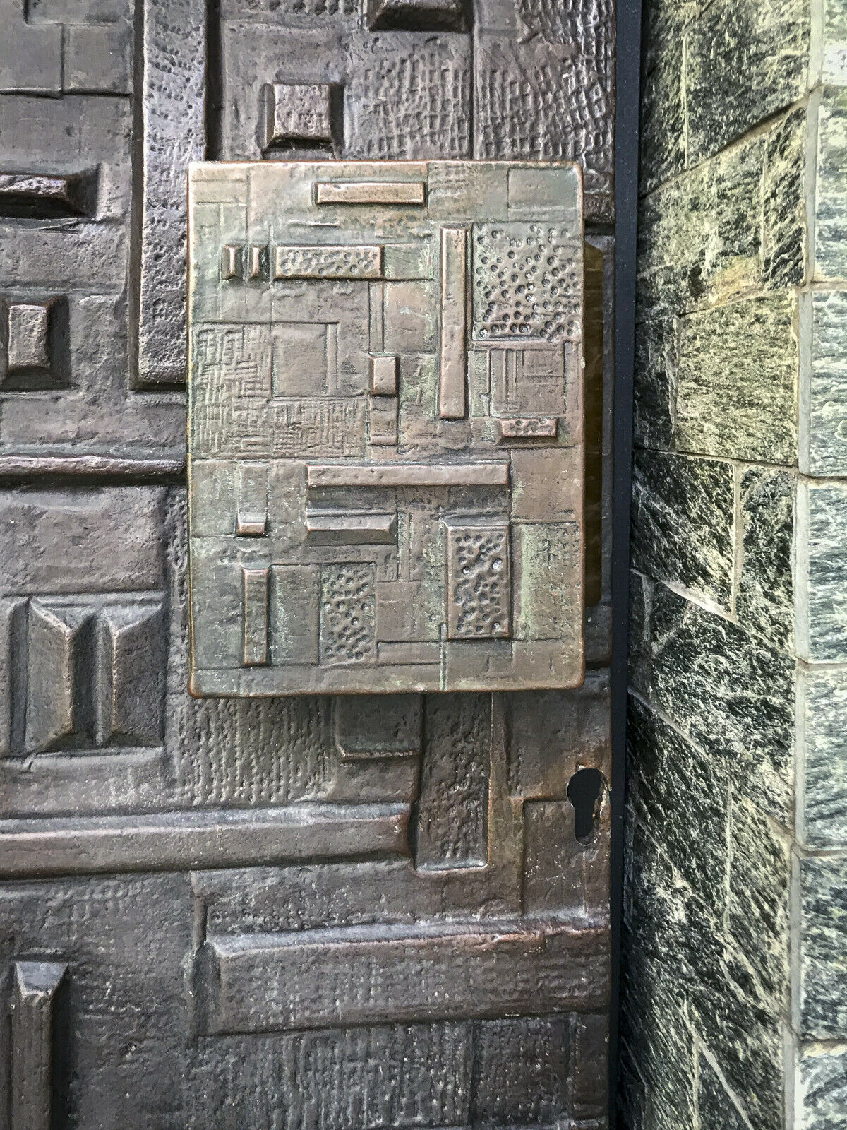 Copper brutalist entrance door, 70s architecture