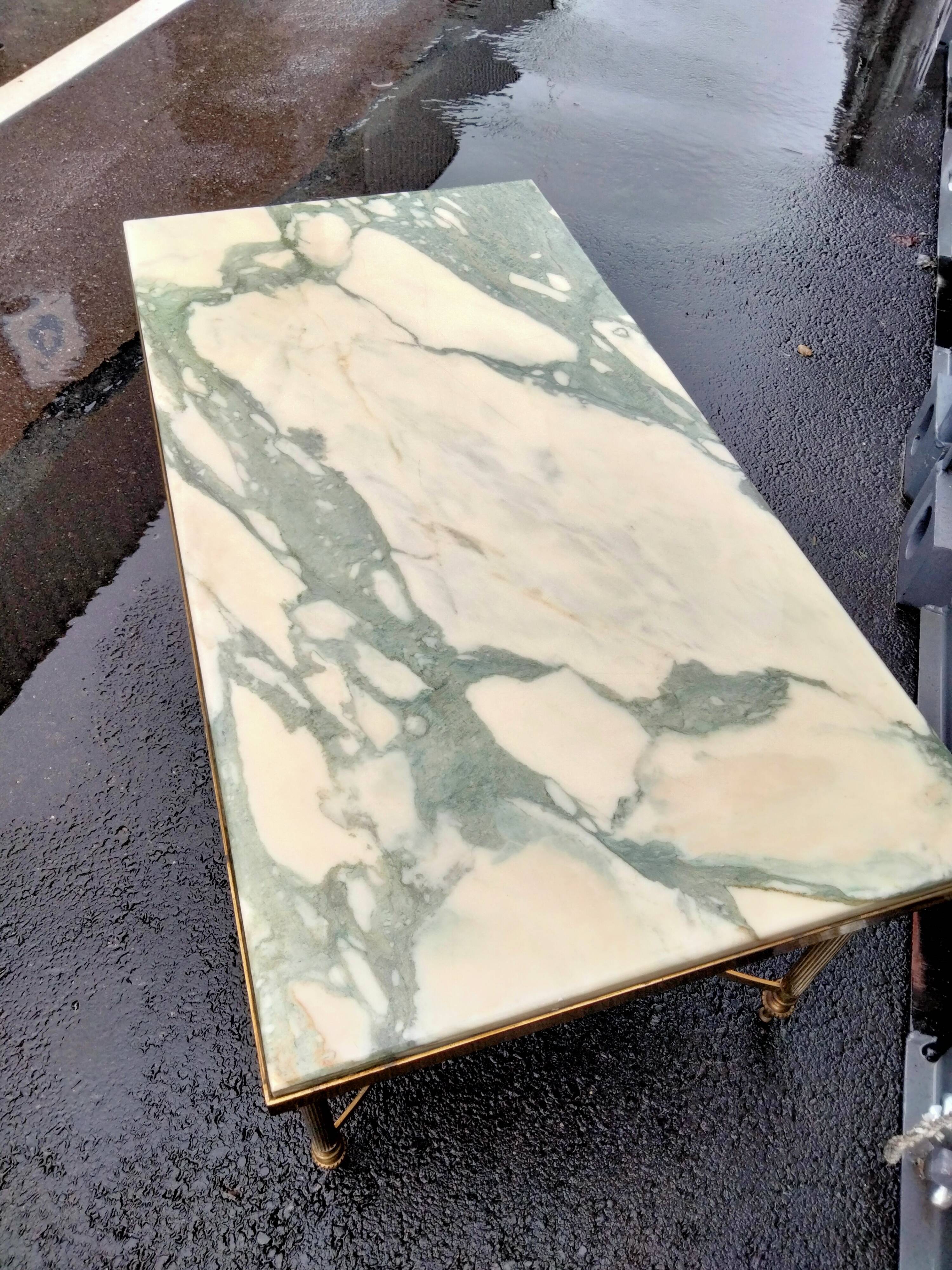 Old vintage gilded side table with marble top