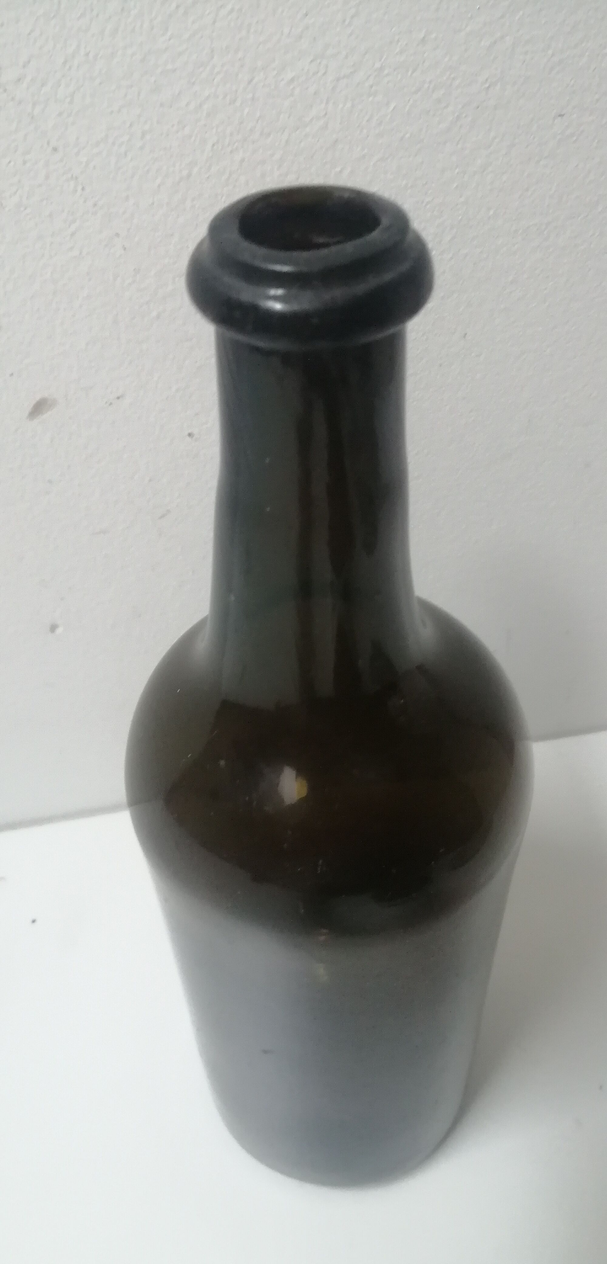 Old bottle made of blown glass