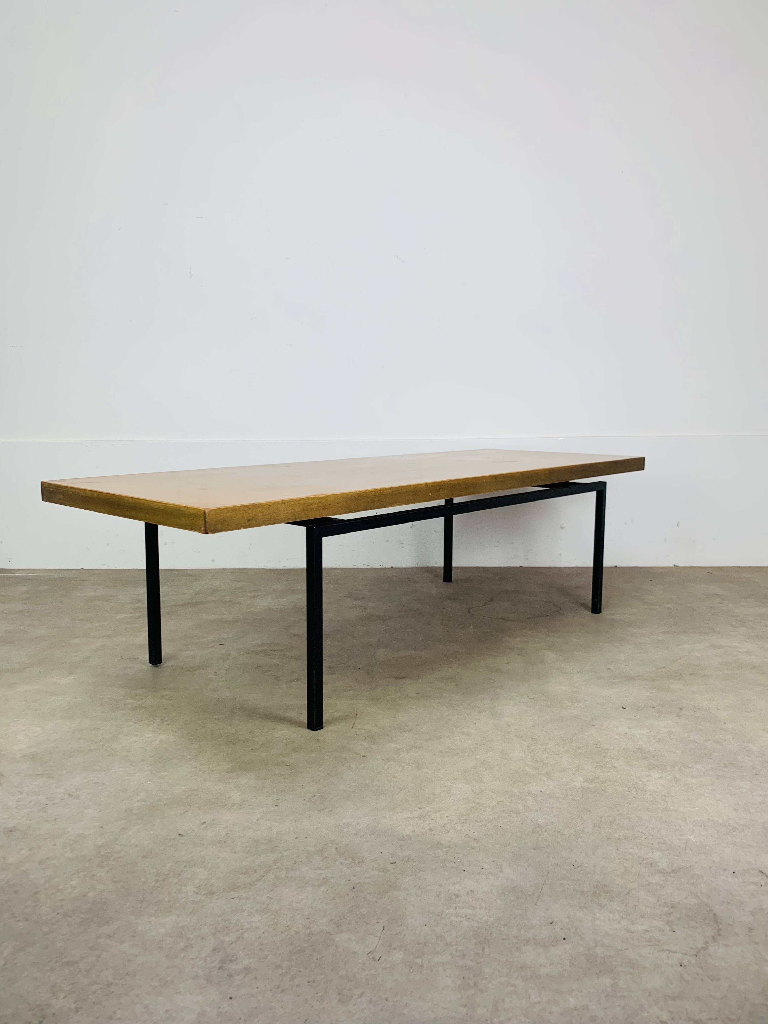 1950s modernist coffee table, wood and black metal.