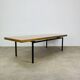 1950s modernist coffee table, wood and black metal.