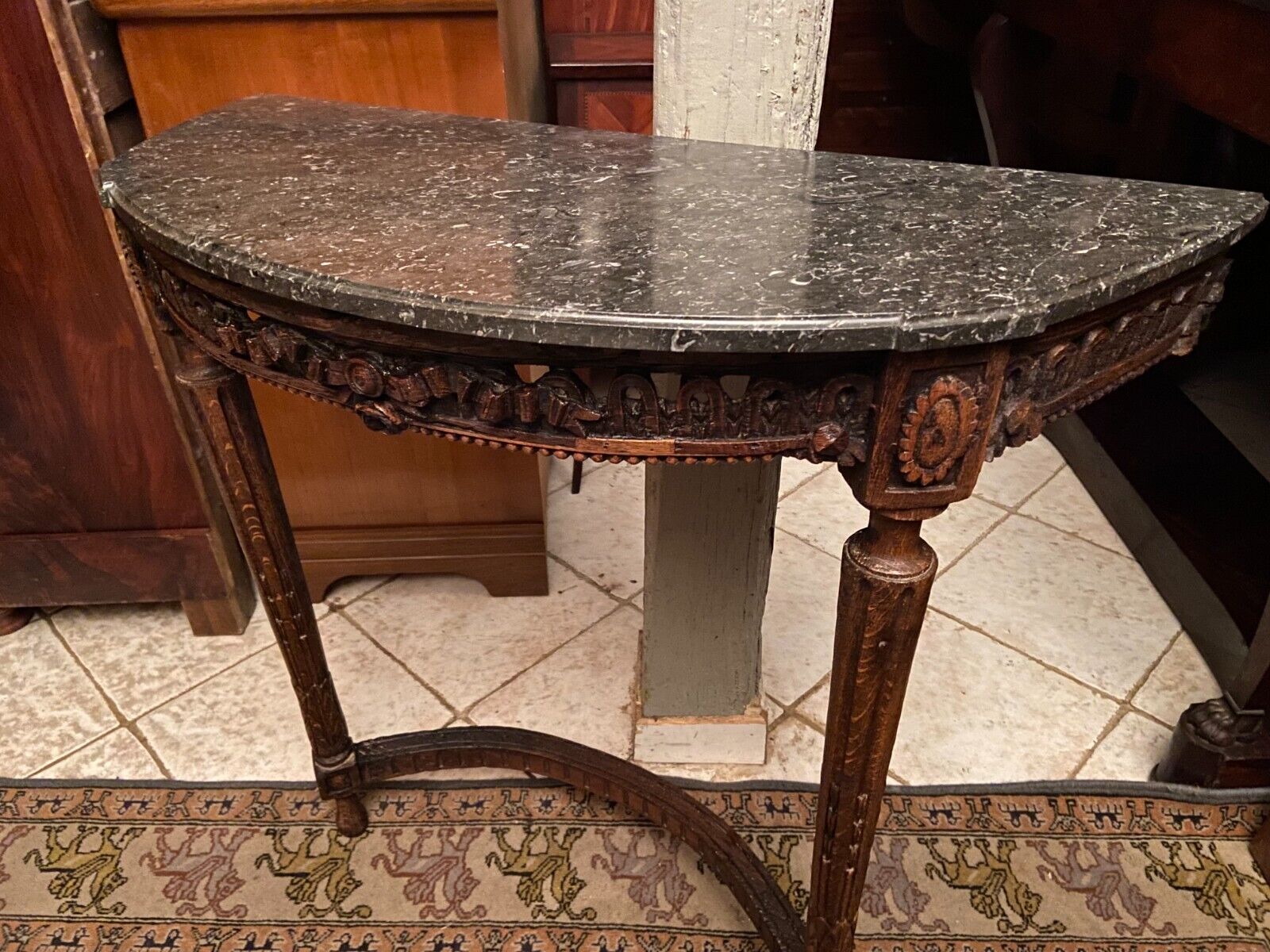 Half-moon console eighteenth century solid oak with carved decoration Louis XVI era