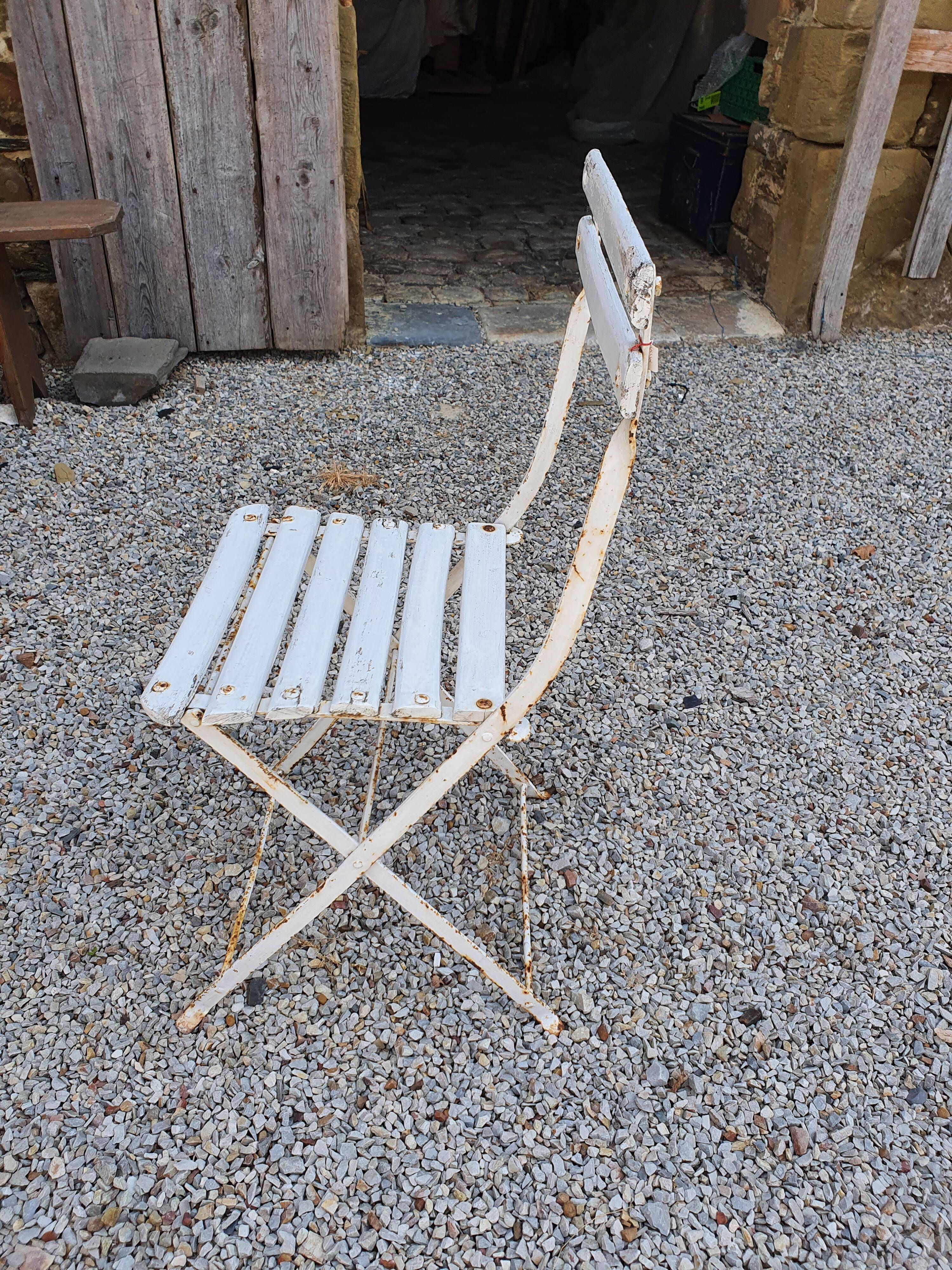 Wooden slatted garden chair with wooden slats and iron feet