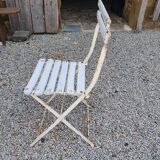 Wooden slatted garden chair with wooden slats and iron feet