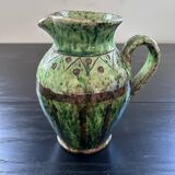 Old pitcher with ethnic decor