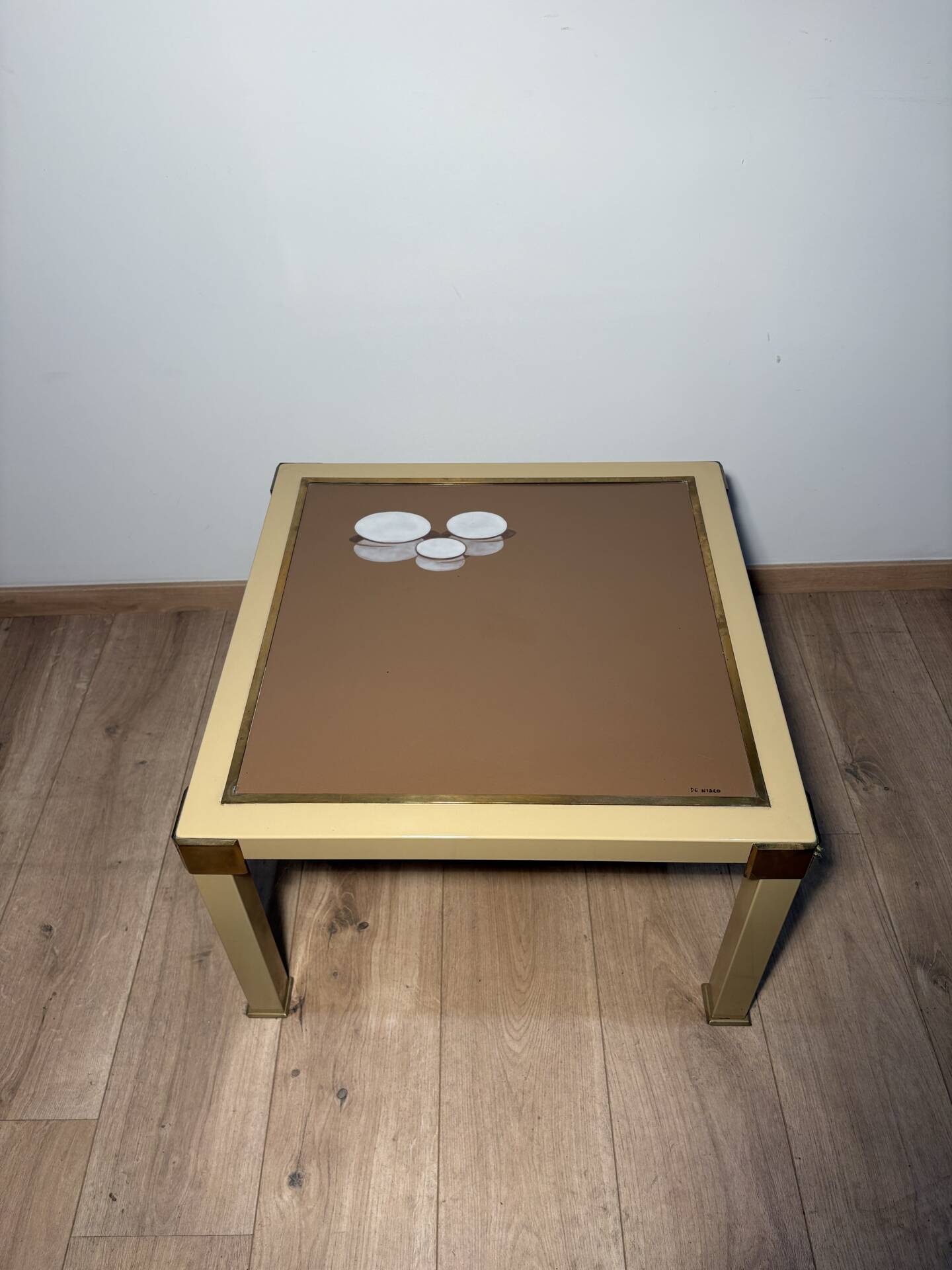 Metal and brass coffee table in ceramic by Nisco.