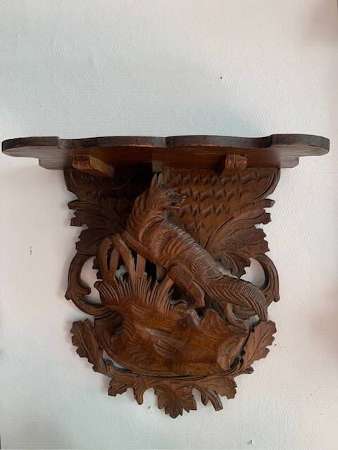 Black Forest carved wooden wall console, harness with wolf decoration