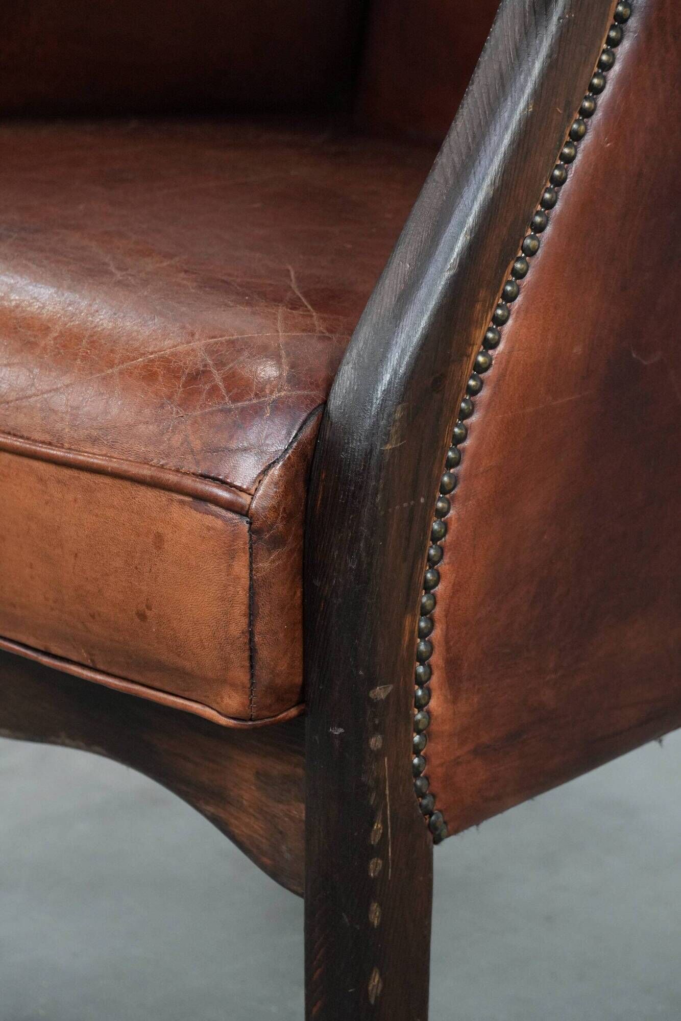 Classic vintage wingback chair in sheepskin and wood