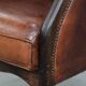 Classic vintage wingback chair in sheepskin and wood