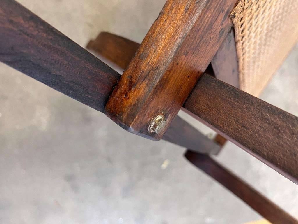 Antique folding chair with weaved seat/back