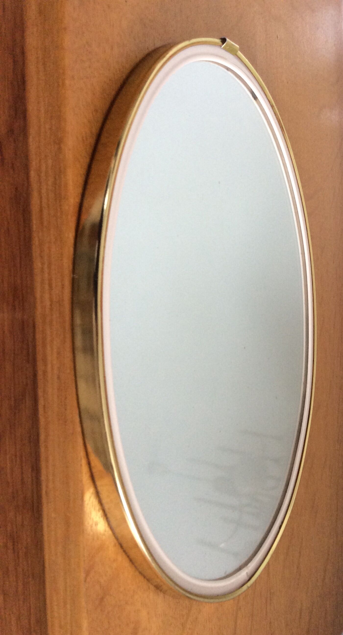 Free-form oval sheathed mirror from the 60s and 70s