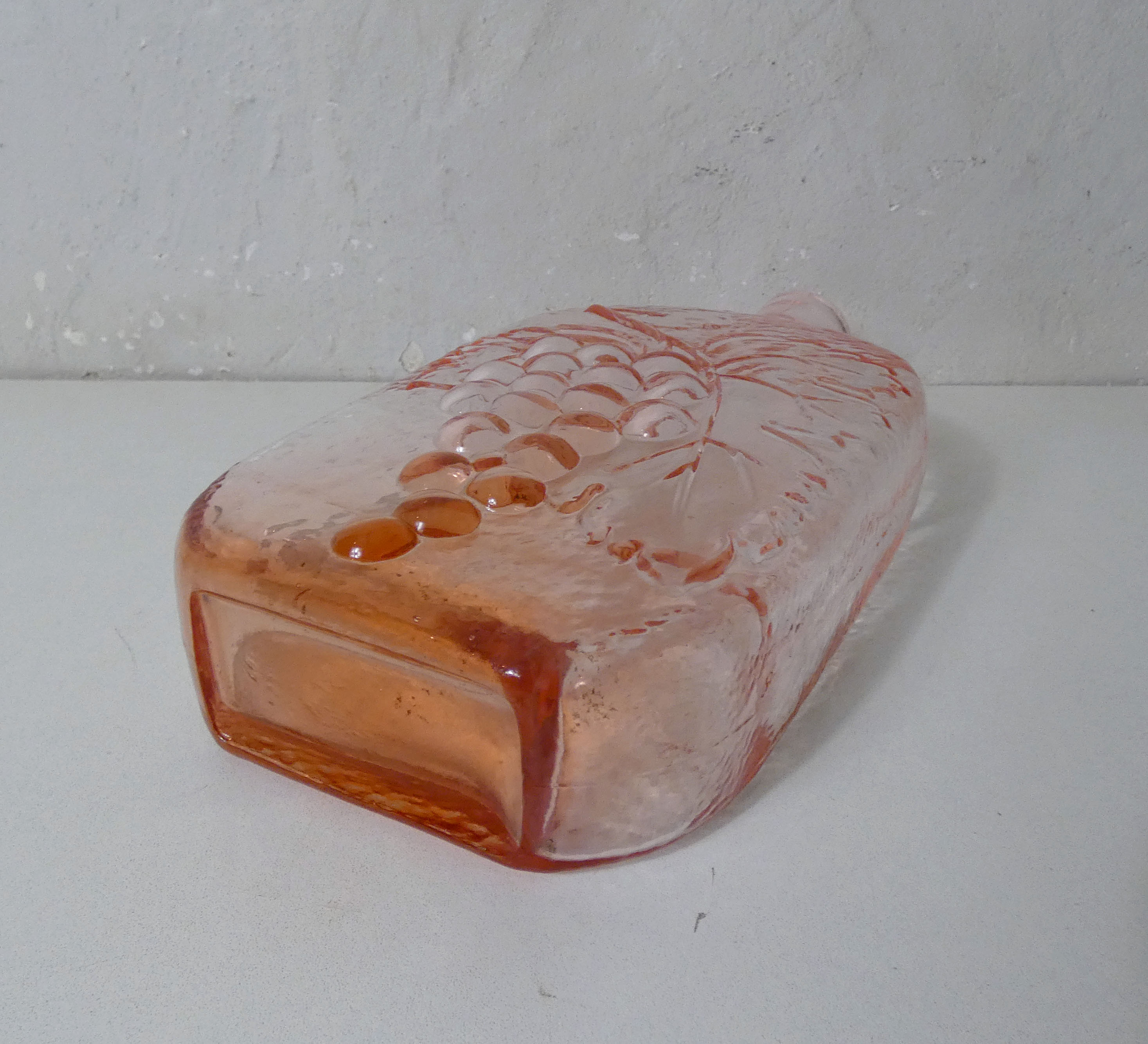 old carafe in orange pink glass