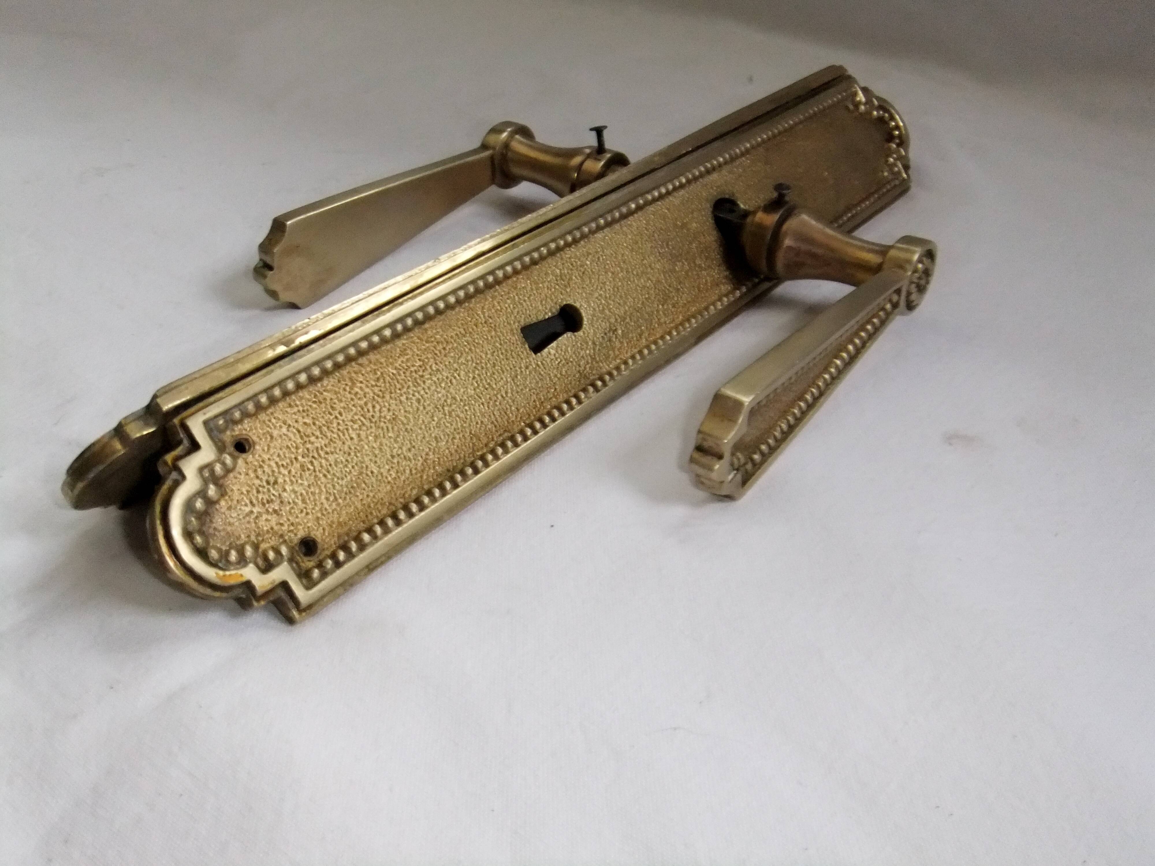 Pair of Louis XVI style beaded bronze door handles