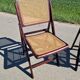 Set of 2 folding chairs in wood and cane.