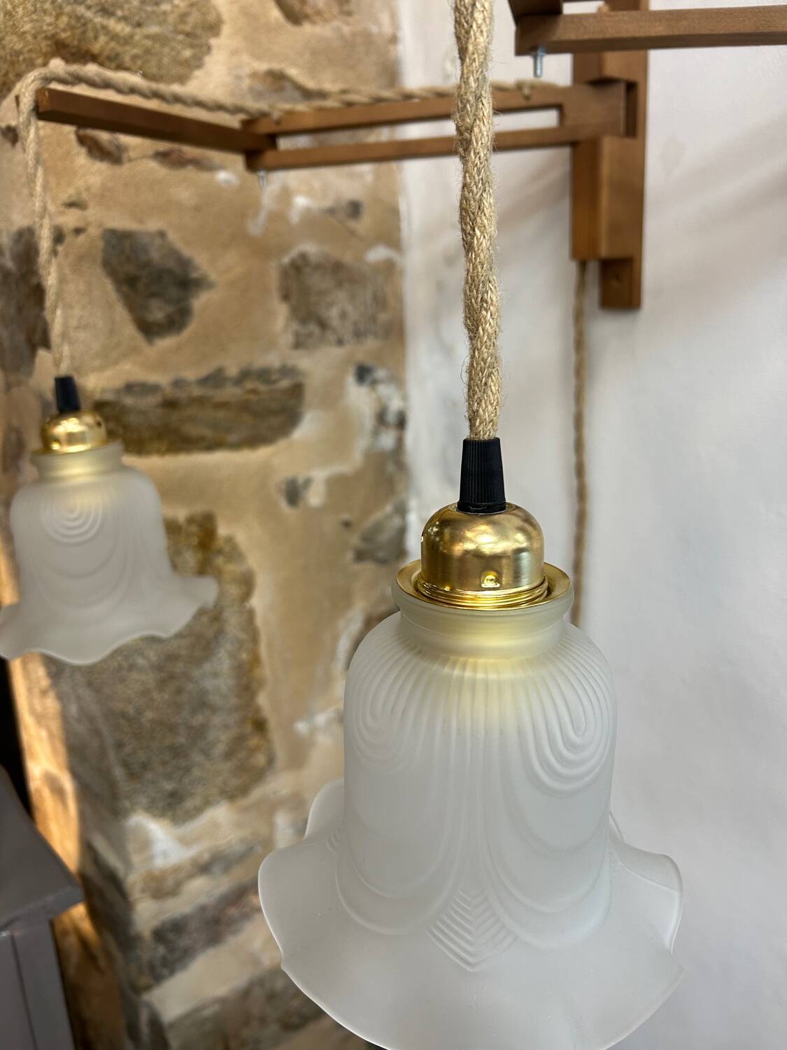 Two portable lamps with wall mount.