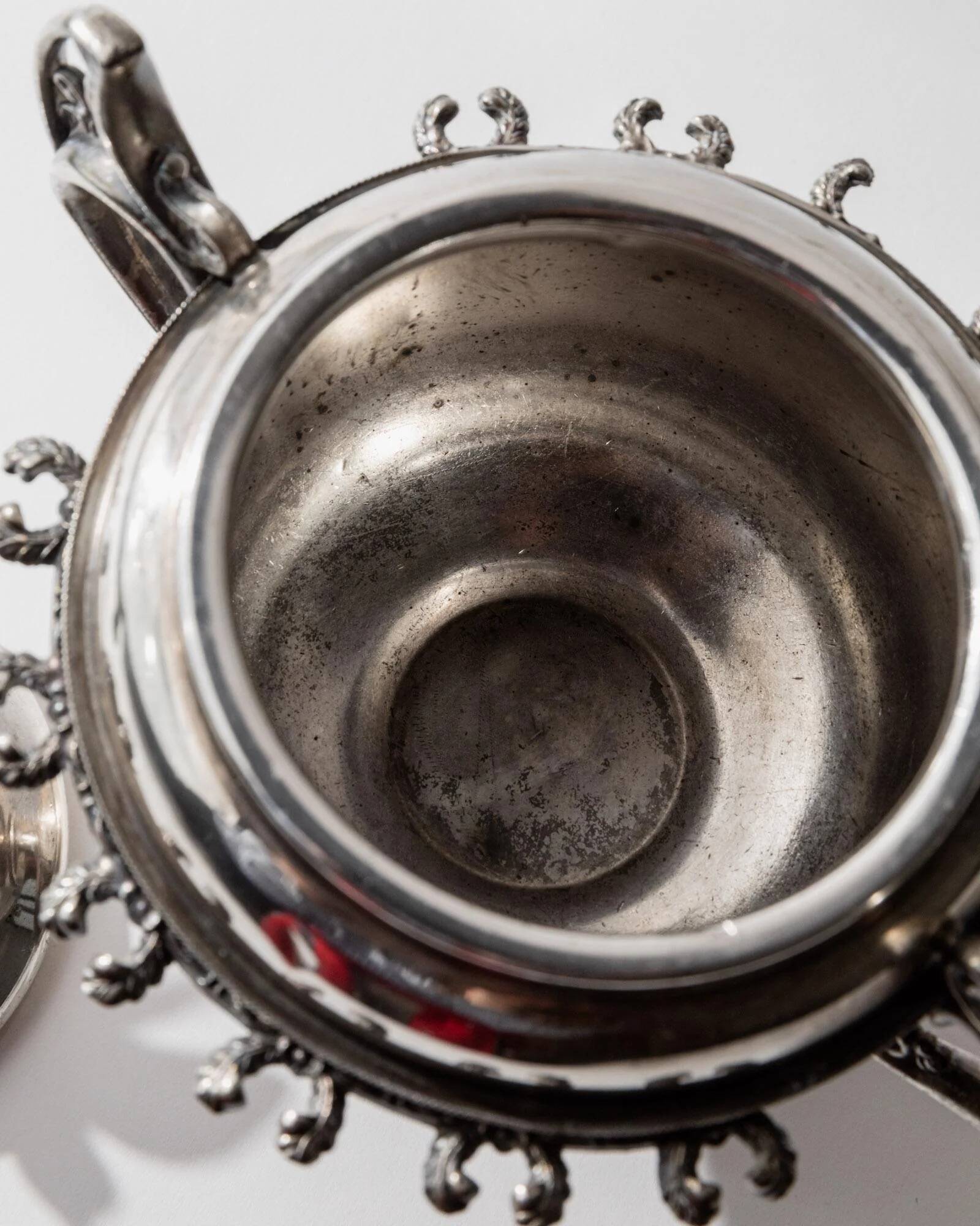 Vintage 1930s silver-plated footed bowl with lid by Warren Rogers New York, featuring a bird motif and ornate details.
