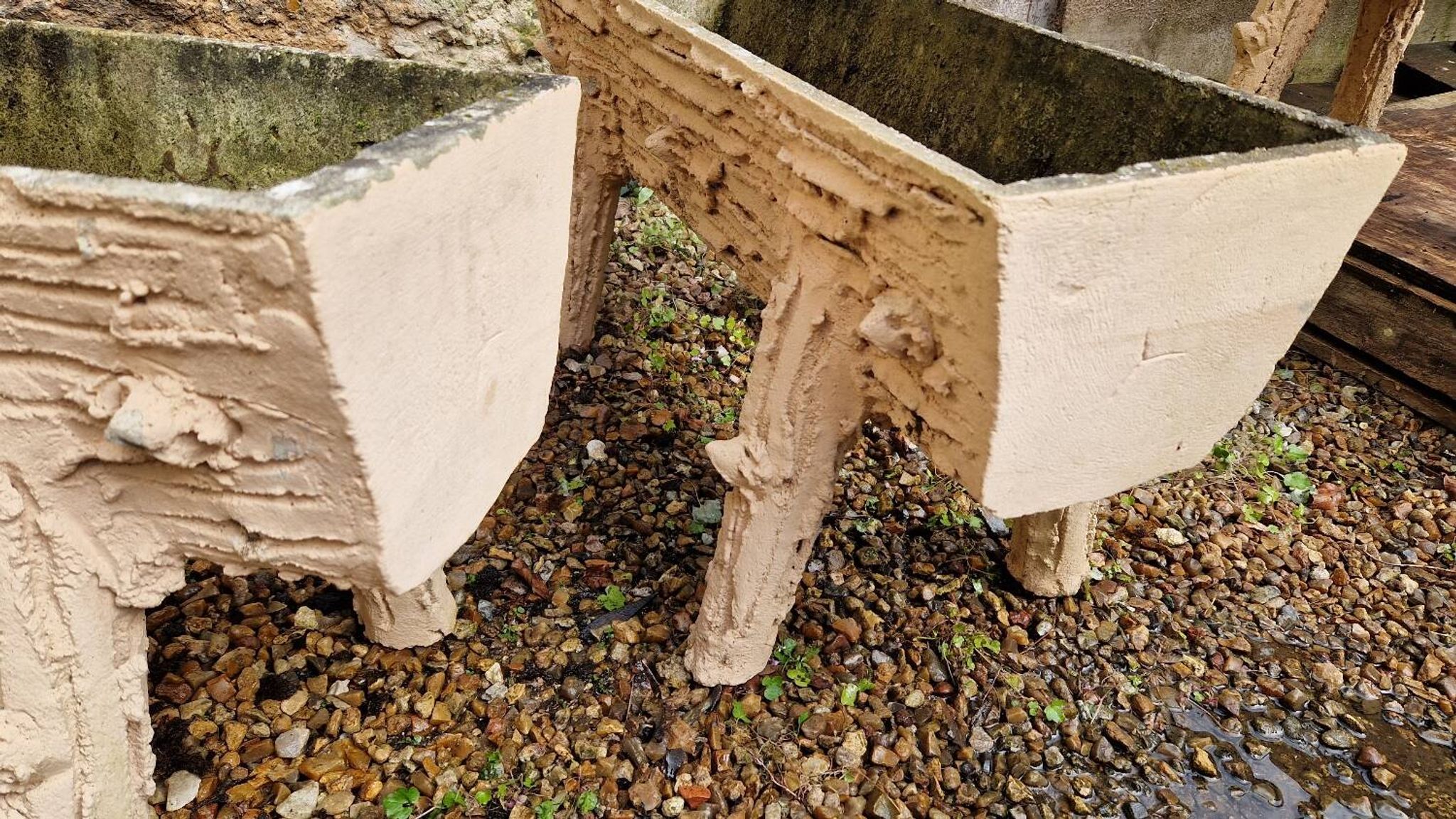 Pair of cement planters in faux wood finish