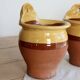 Pair of vintage wall planters in yellow glazed stoneware.