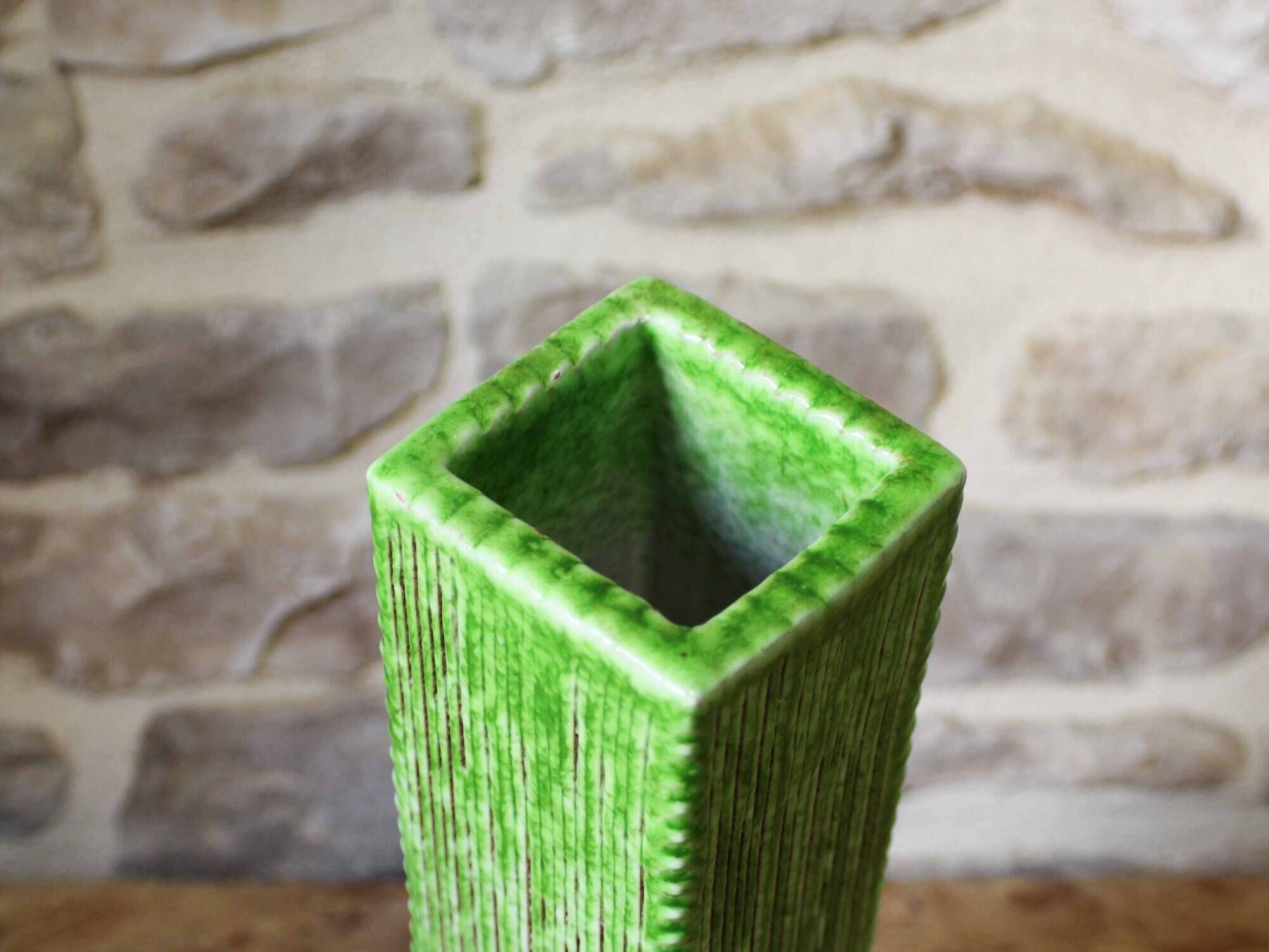 Incised ceramic vase with a square section