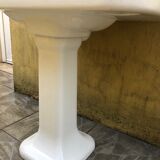 Antique washbasin on ceramic column