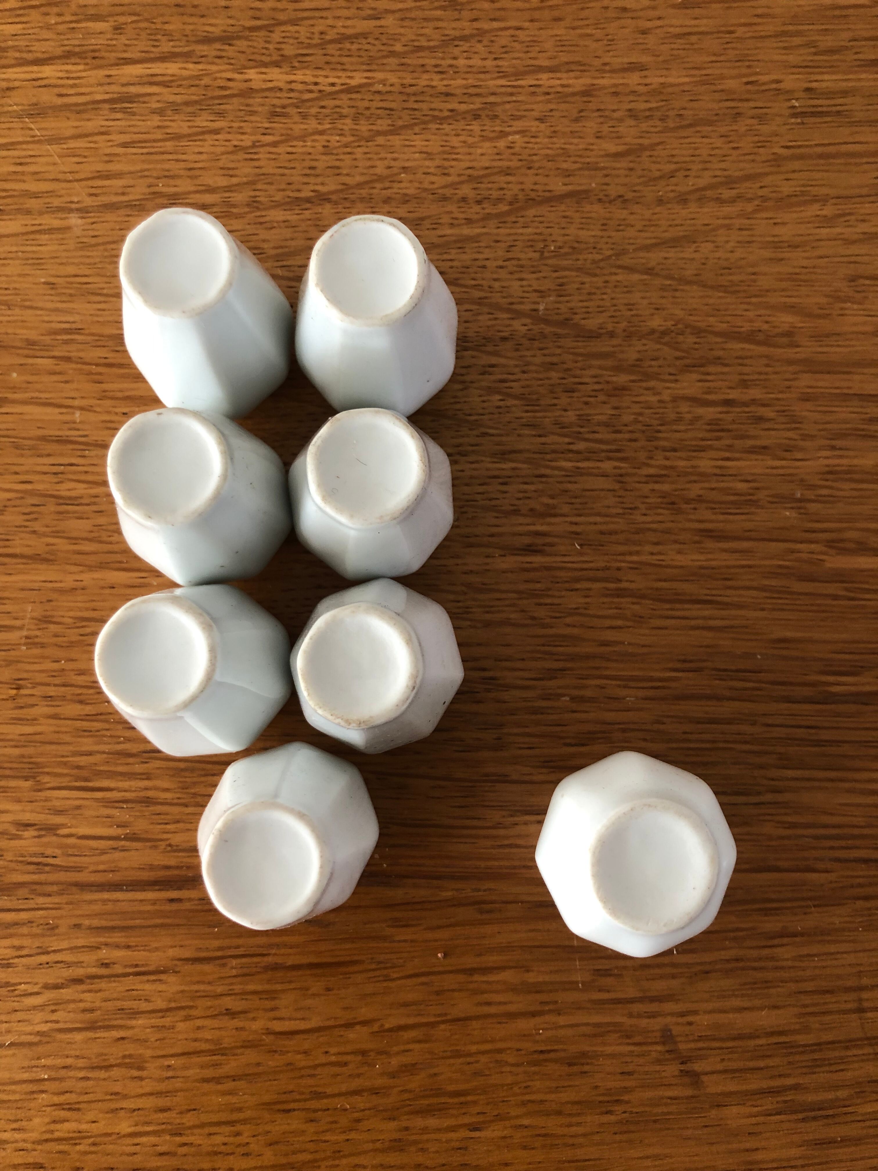 8 miniature vases in white earthenware
