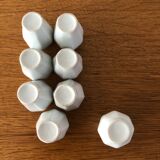 8 miniature vases in white earthenware