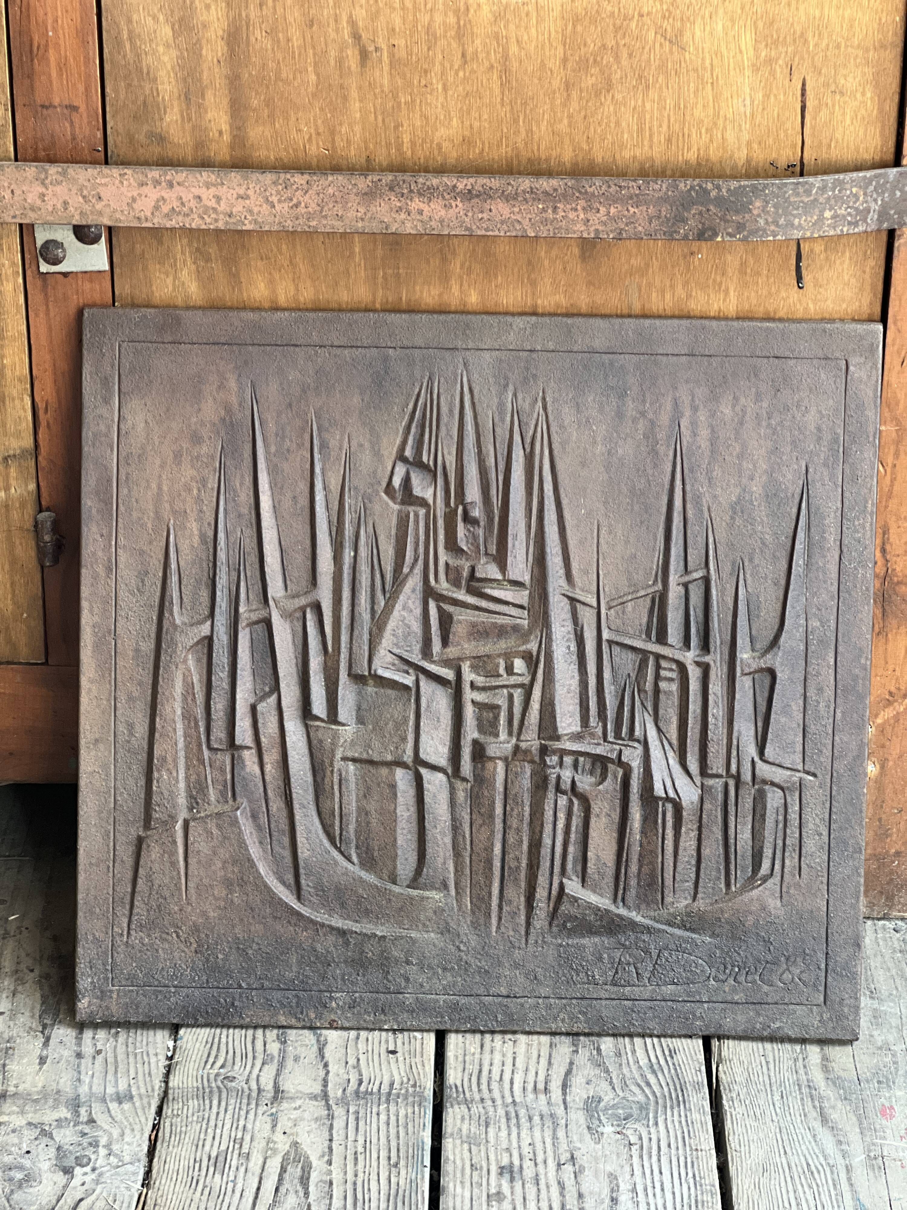 Cast iron plaque signed