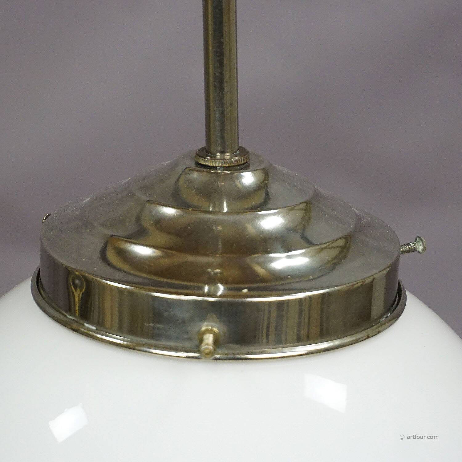 Functional Bauhaus-style pendant light with opaline glass shade.