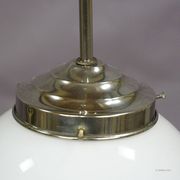 Functional Bauhaus-style pendant light with opaline glass shade.