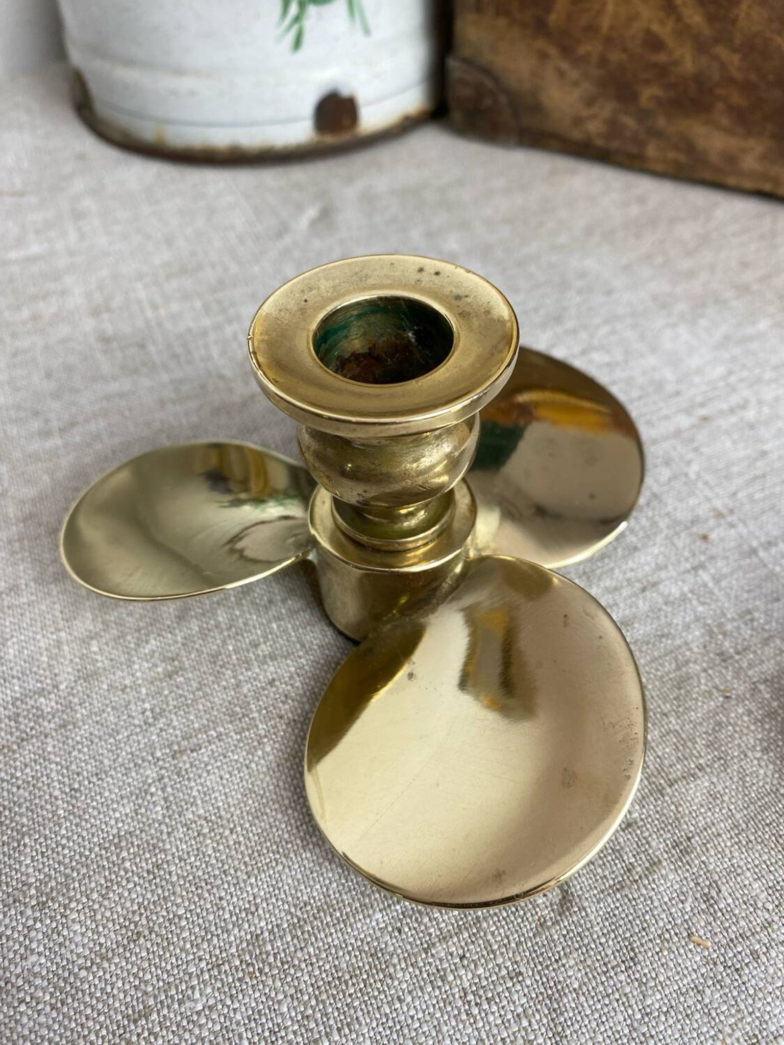 Pair of vintage brass propeller-shaped candlesticks