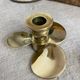 Pair of vintage brass propeller-shaped candlesticks