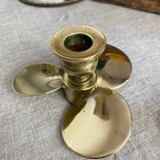 Pair of vintage brass propeller-shaped candlesticks