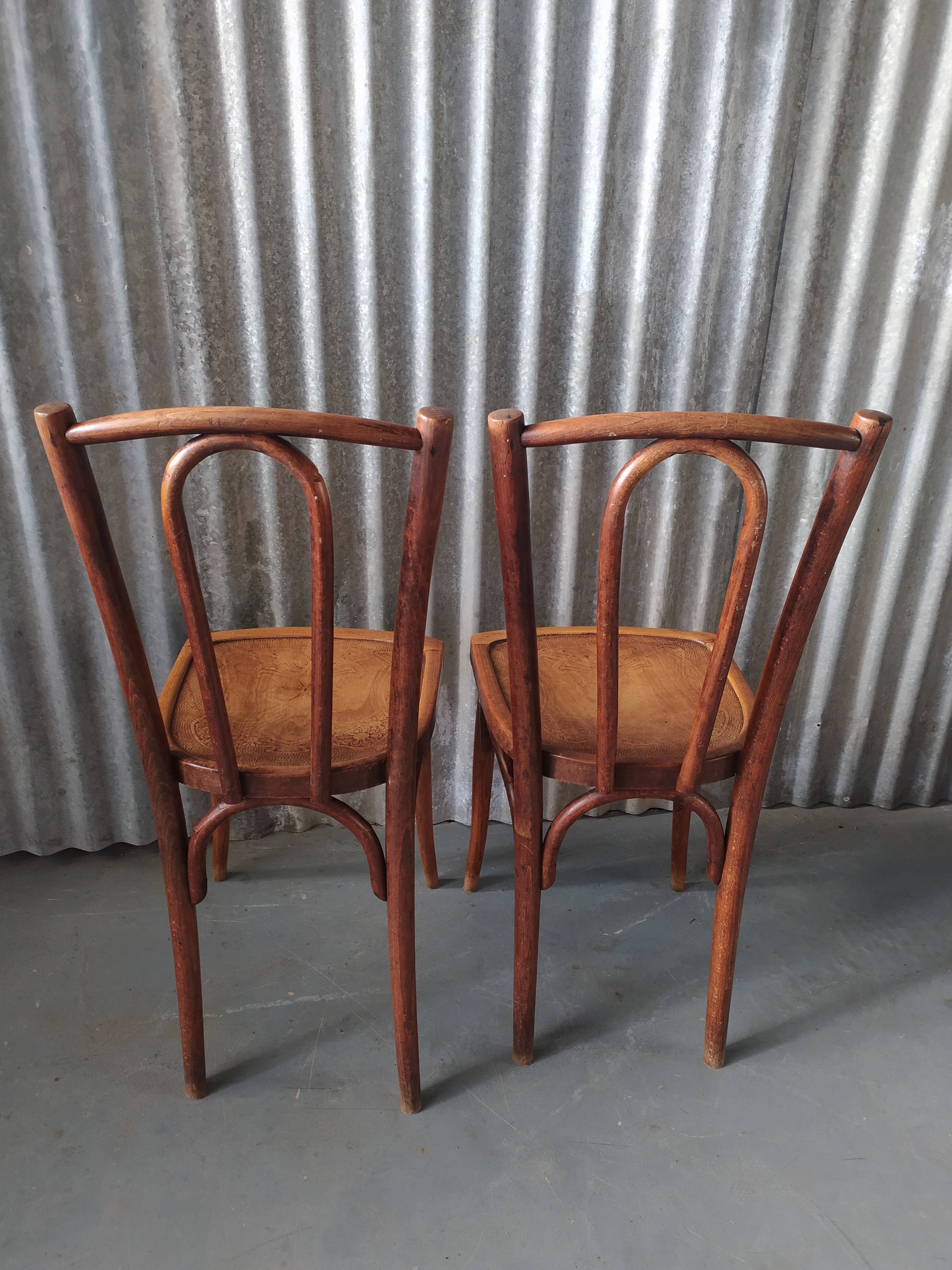 Pair of curved wooden bistro chairs