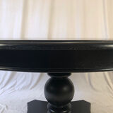 Circular table in blackened wood, central baluster leg
