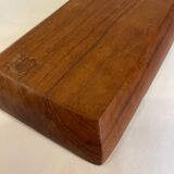 Teak pocket emptier