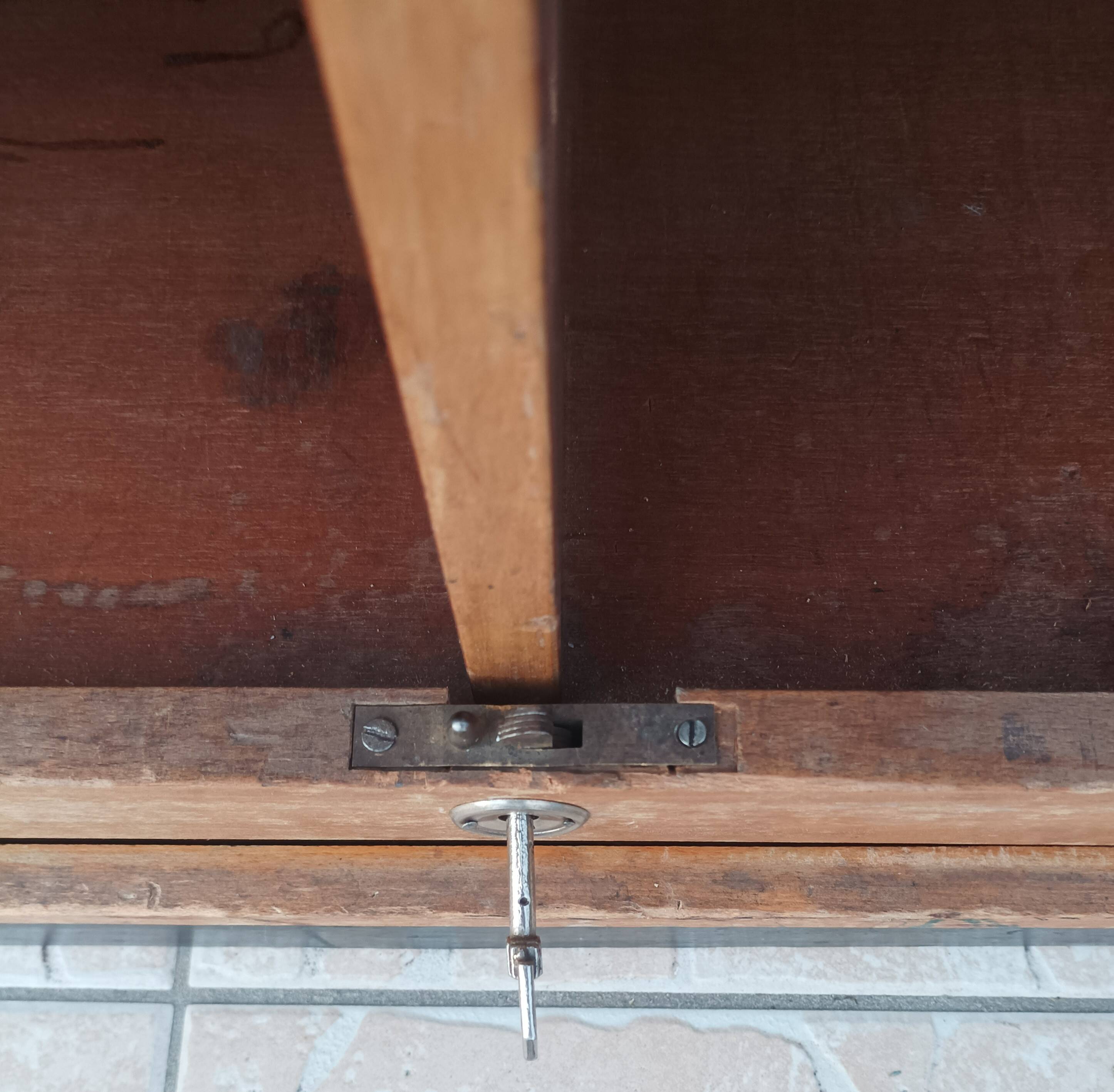 Workshop furniture with drawers and curtain in beech and walnut.