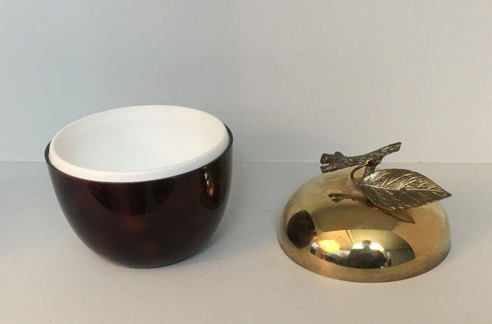 Apple-shaped ice bucket in red celluloid, gold-tone metal and plastic