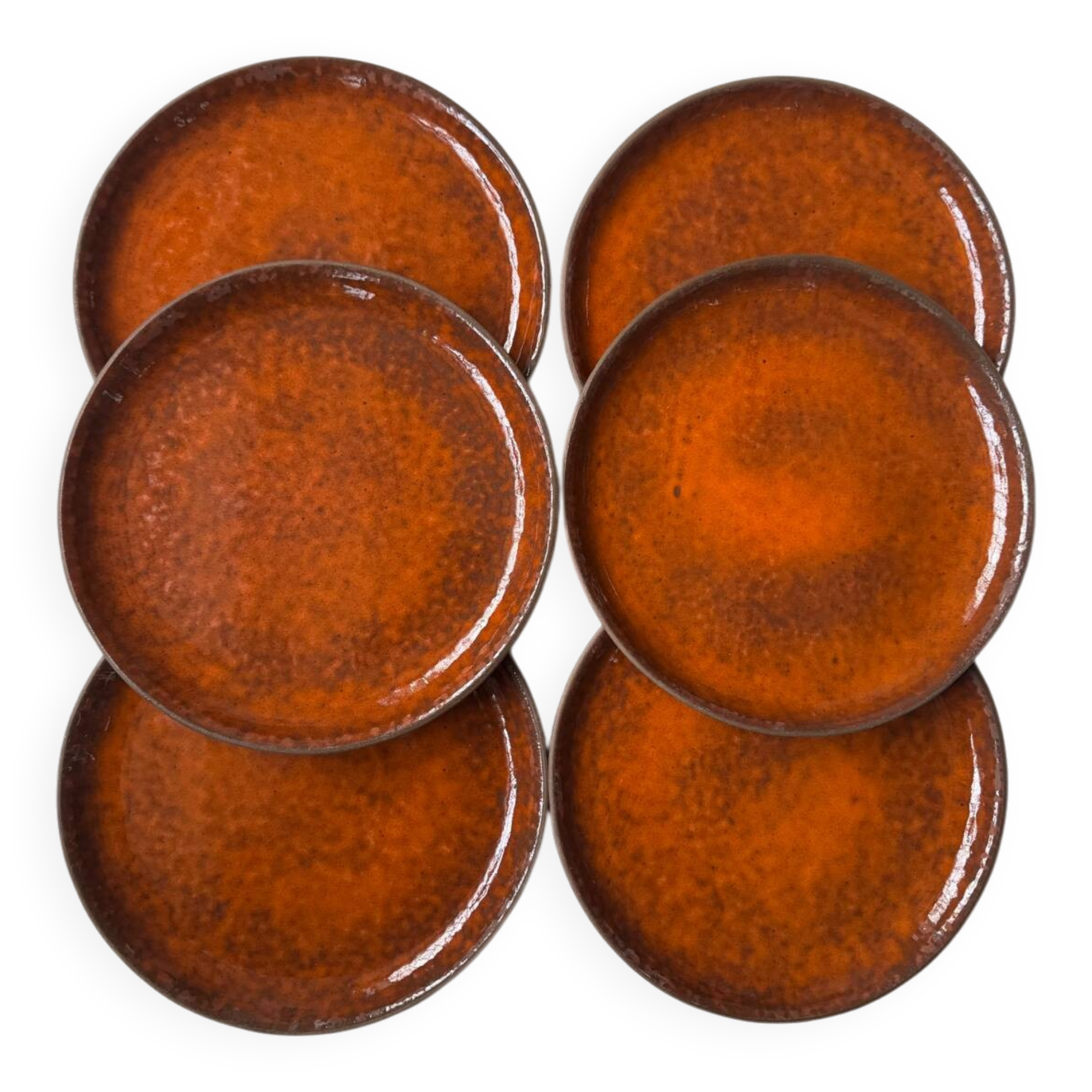 Orange glazed ceramic plates from the 1970s