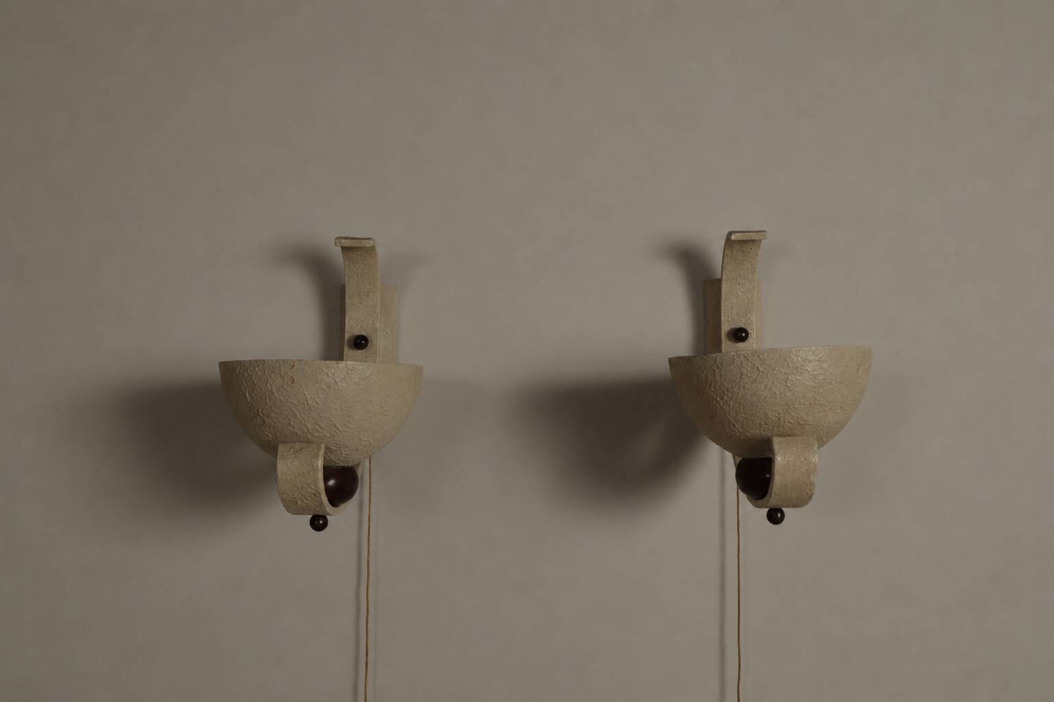 Pair of sculptural mid-century wall uplighters, circa 1950