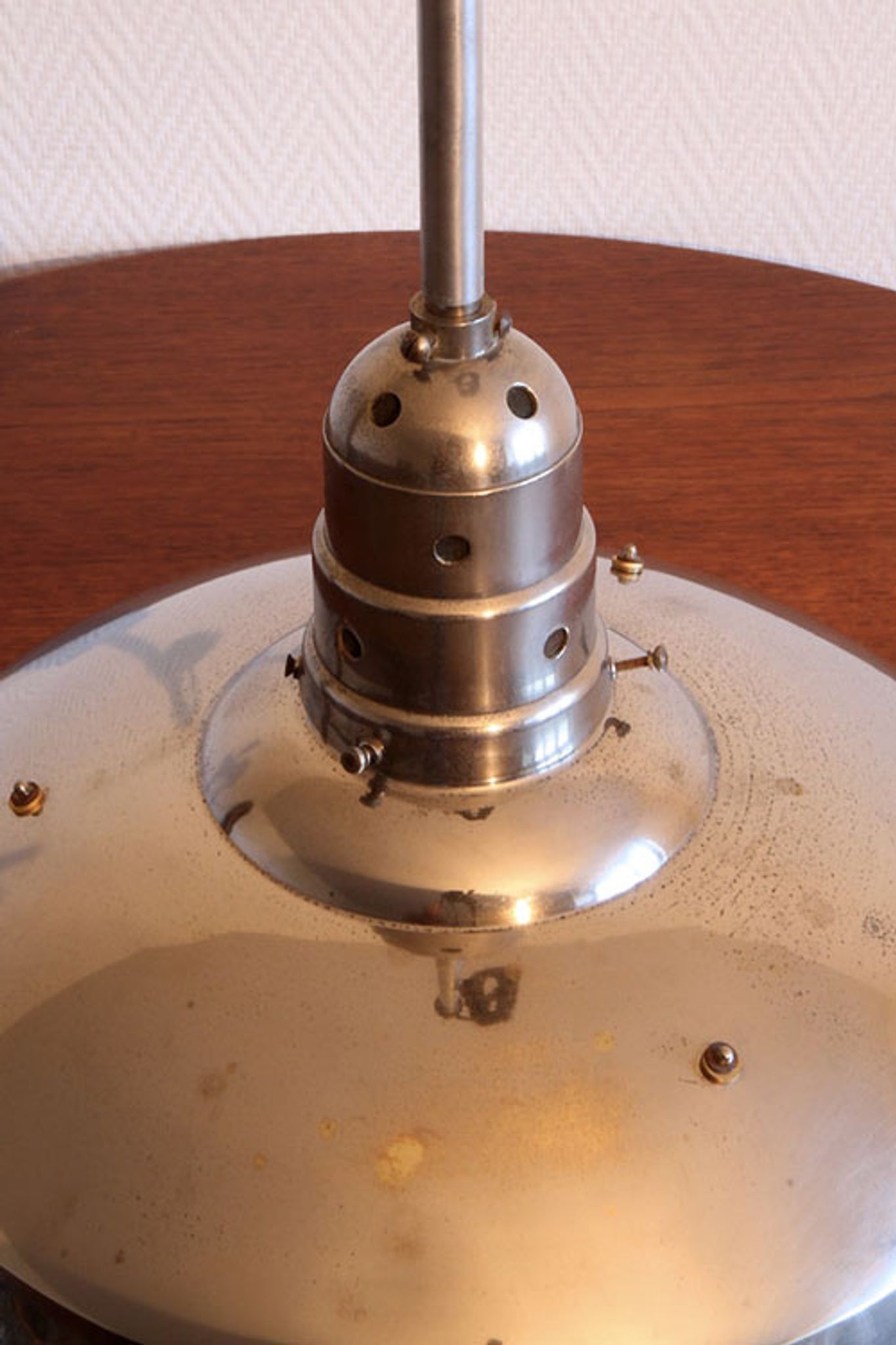 Old Bauhaus lamp in mercurized glass chrome industrial suspension.