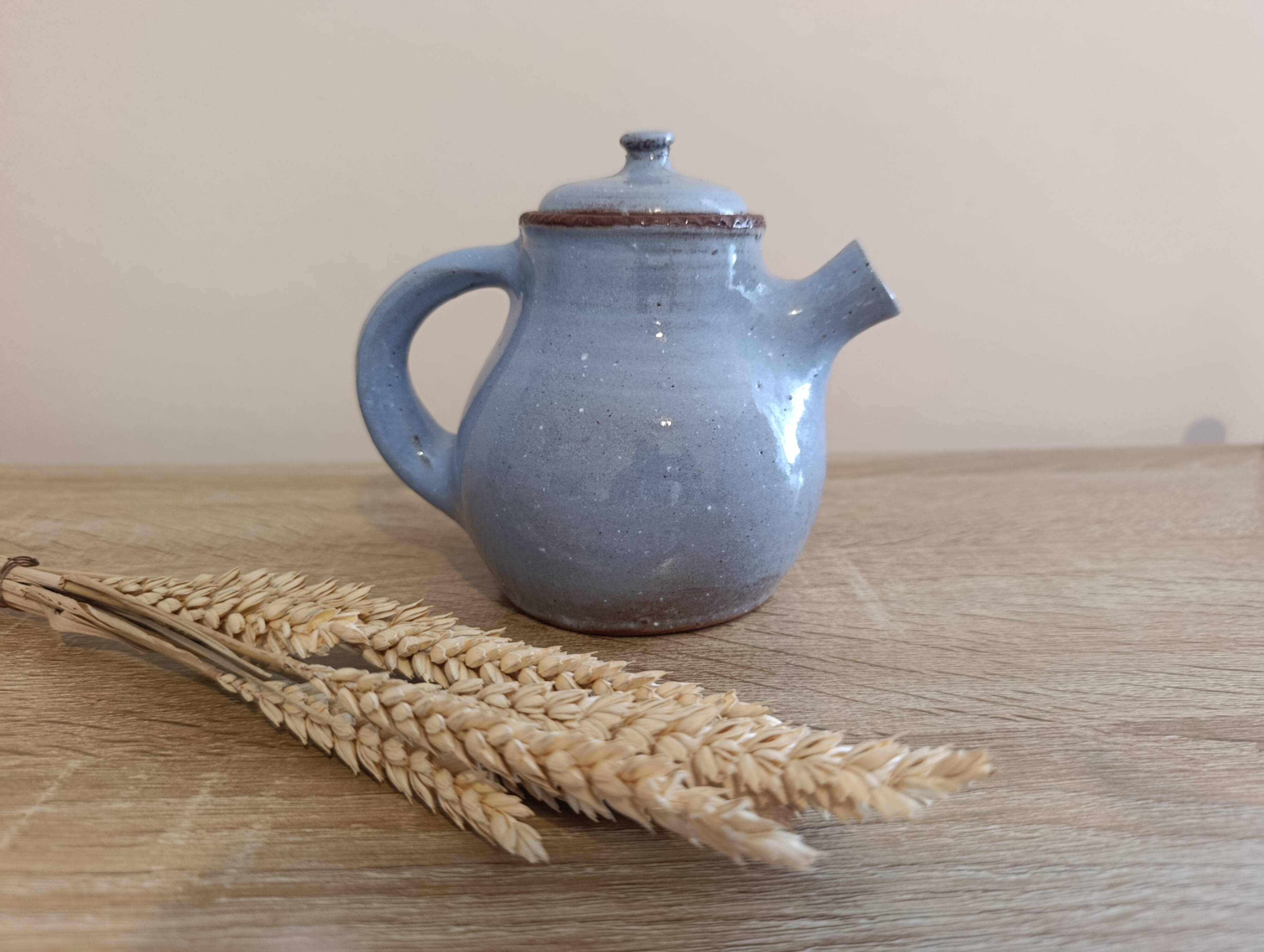 Ceramic teapot in blue/grey glaze, signed by Jeanne and Norbert Pierlot.
