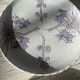 Pair of plates with blue thistles.