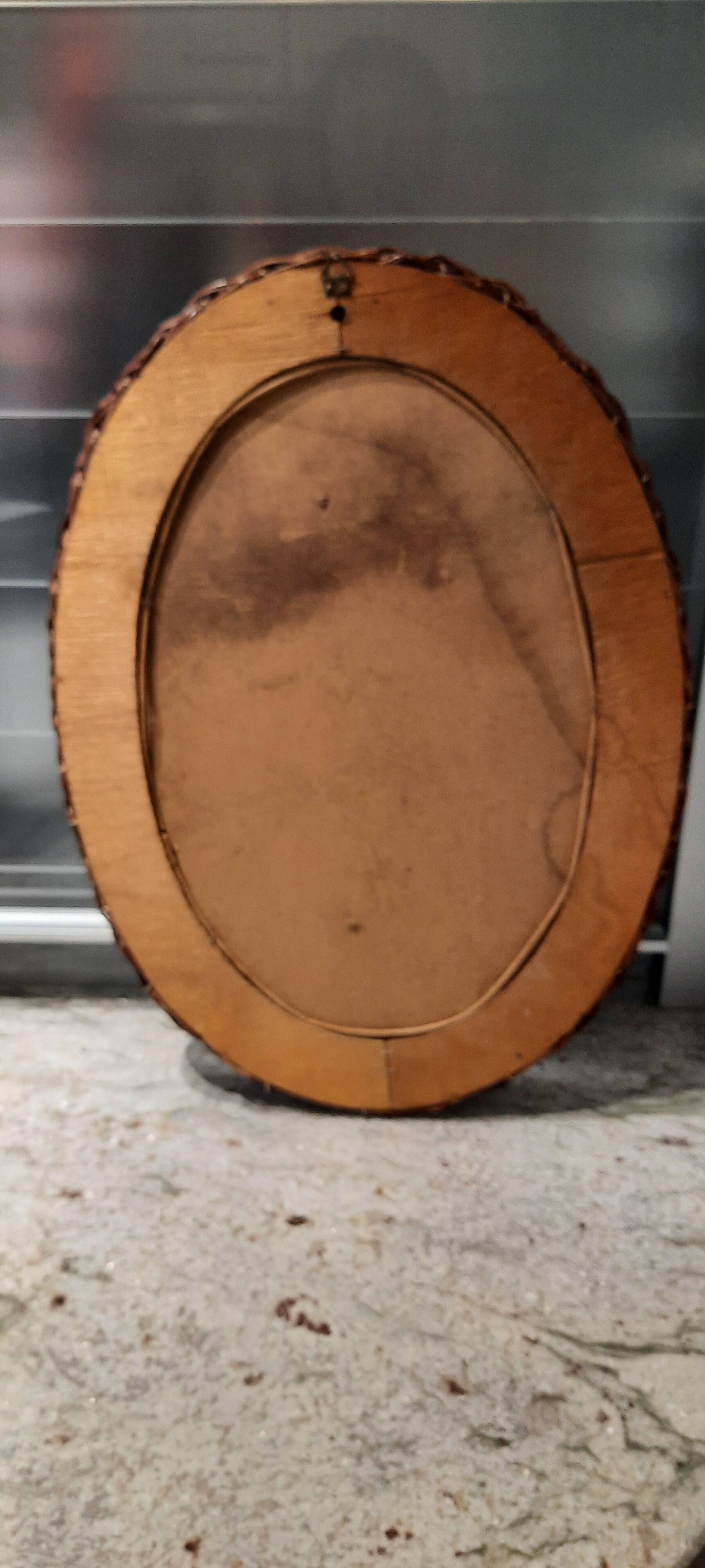 Vintage woven wicker oval mirror